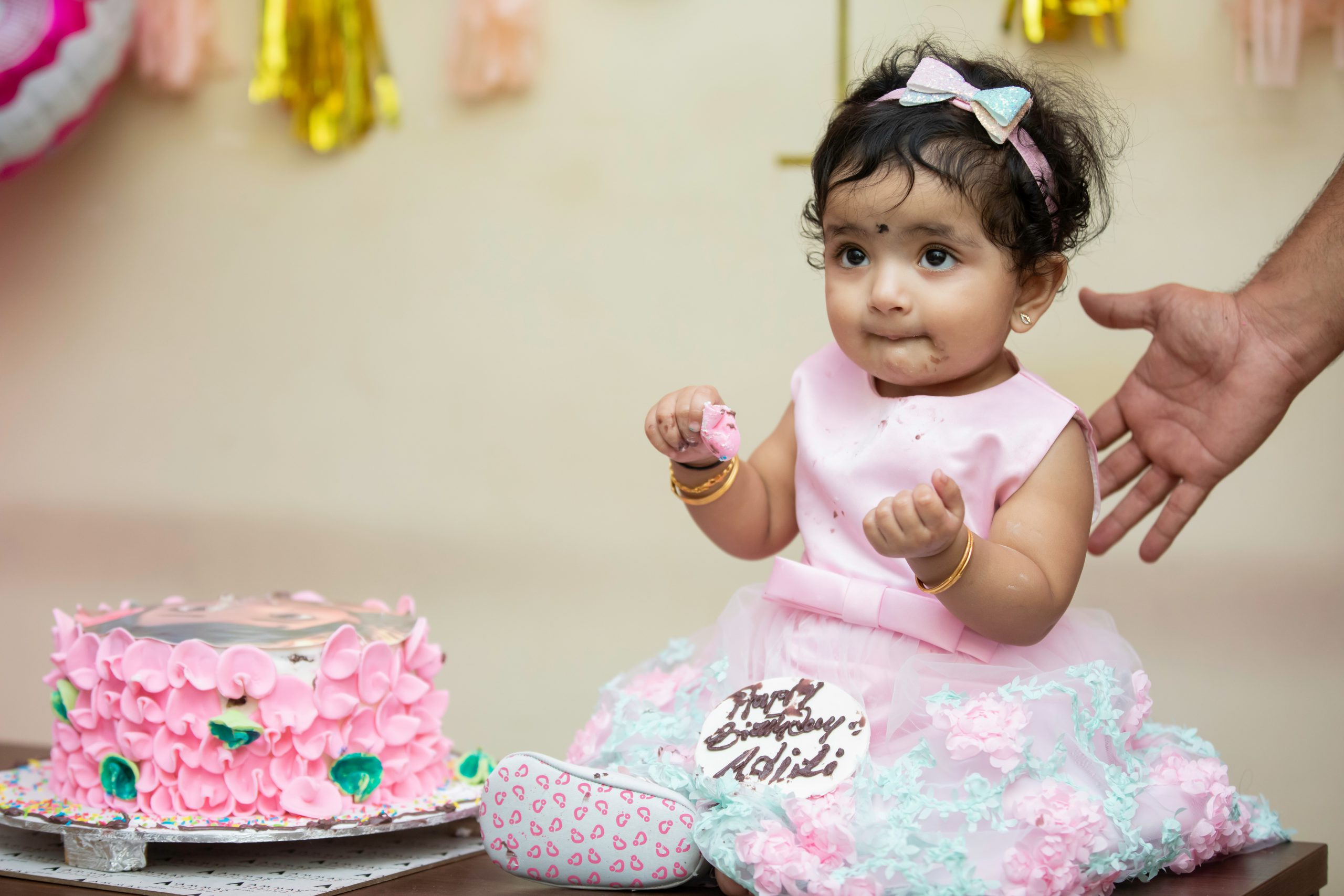 little girl eating birthday cake