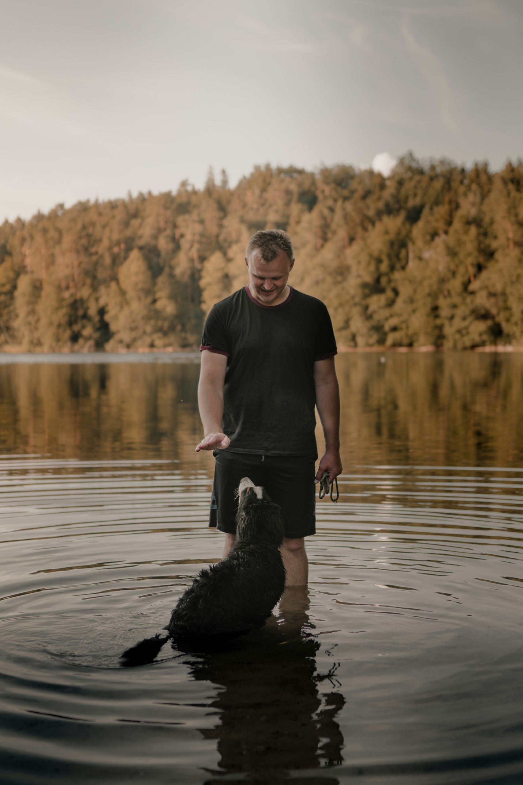 dog and man in river